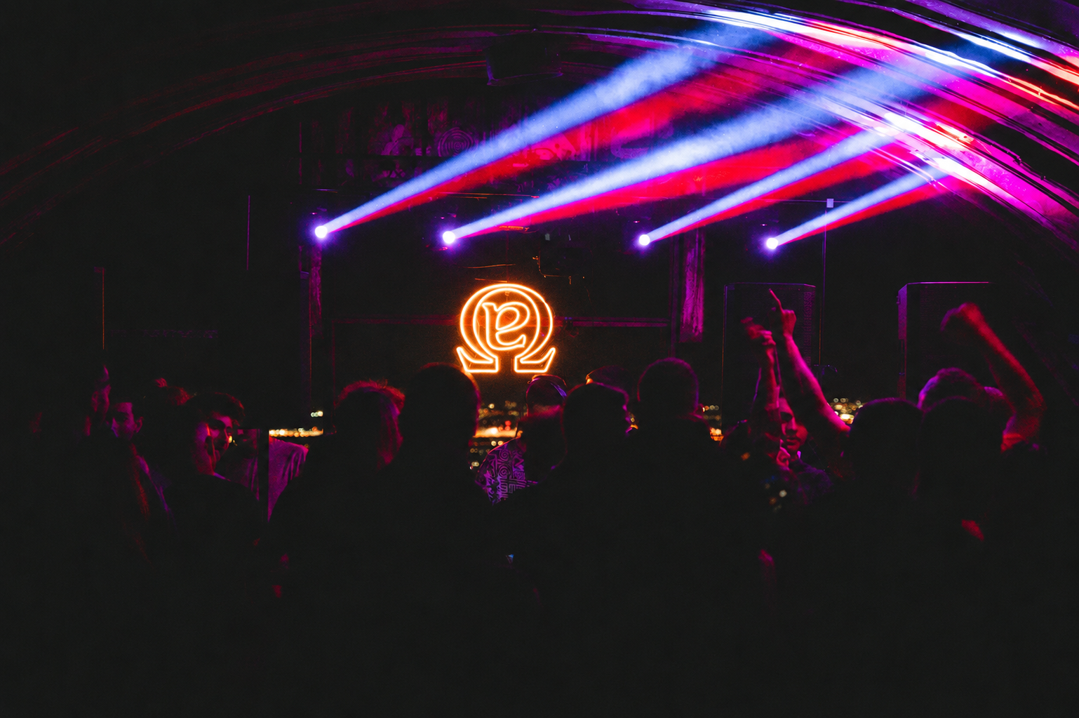 Alpha Omega neon symbol and stage lighting