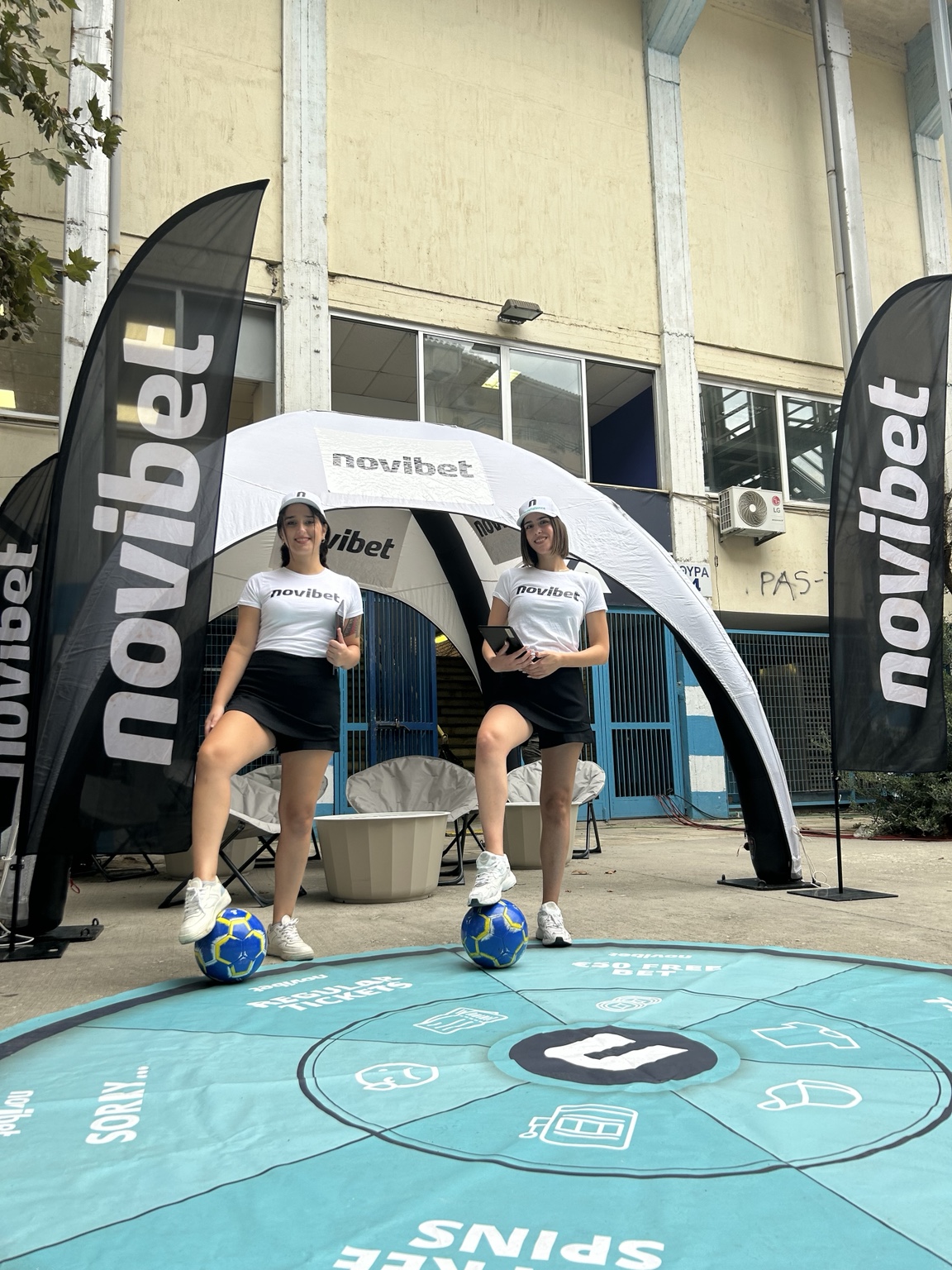 Novibet promotional team at a football stadium activation