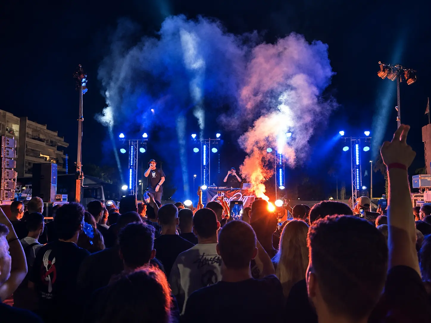 Rap performance with atmospheric stage lighting