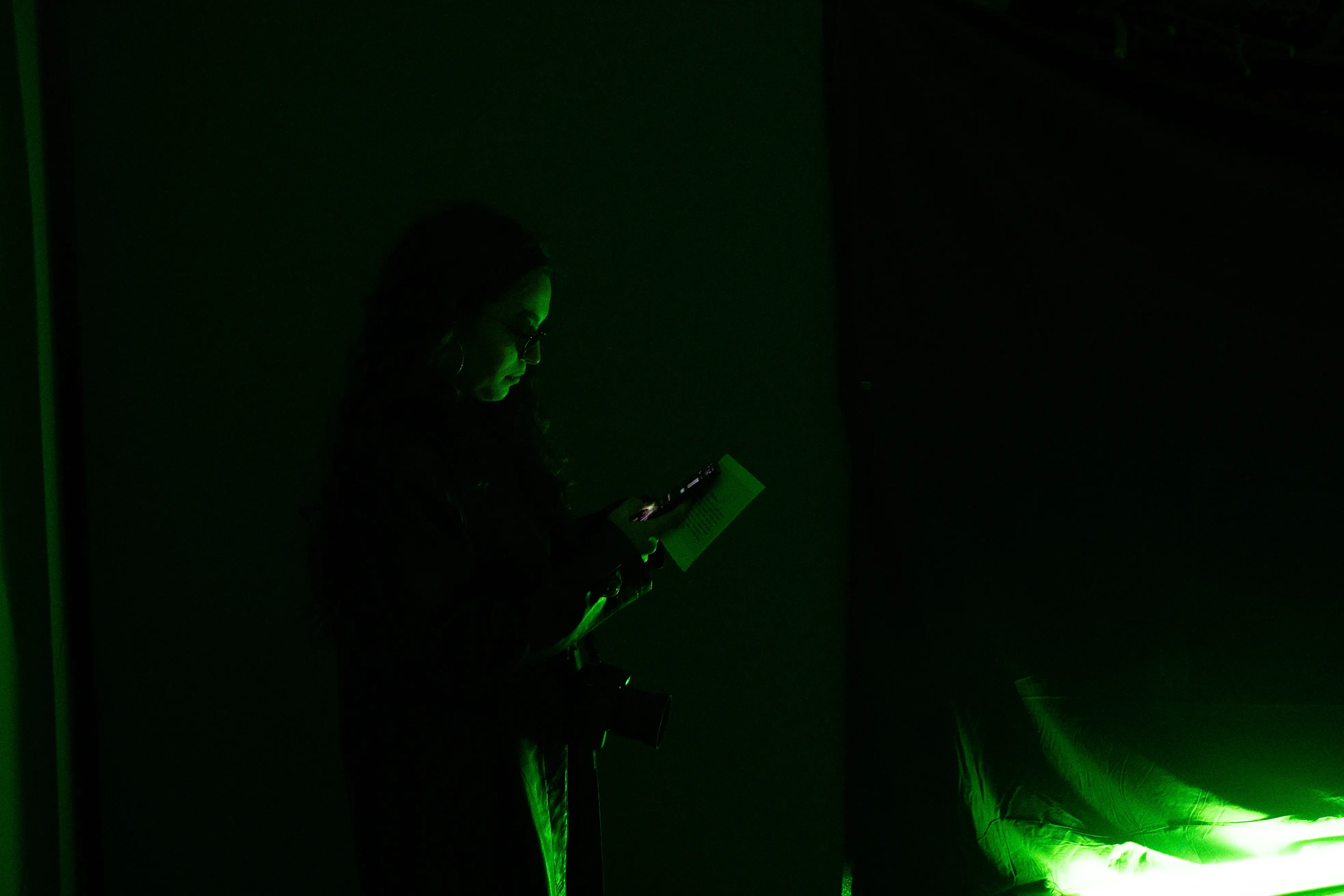 Actor guiding guests through a Matrix-themed challenge